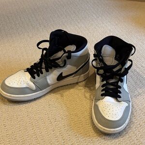 Nike High-Top Air Jordans in White, Gray, and Black